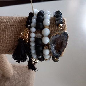 5 stackable bracelets in black & white.